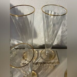4 tall, glass, gold rimmed, champagne flutes. 9.5”